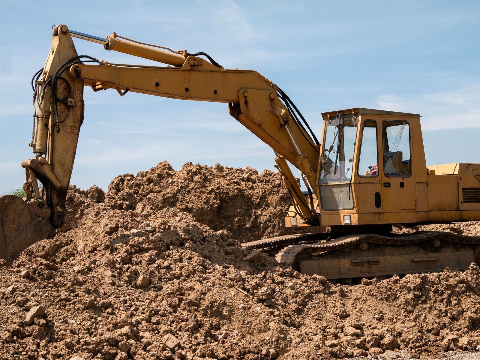 Excavator preparing site for ground works in Galway