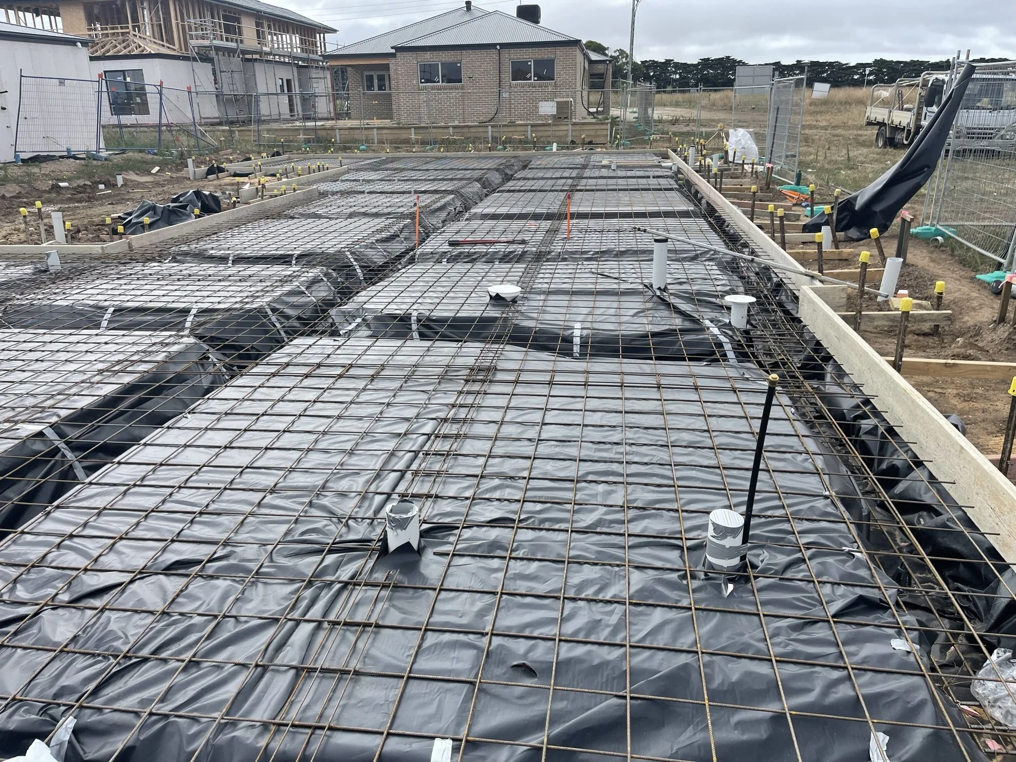Strip foundation trench filled with concrete for extension project