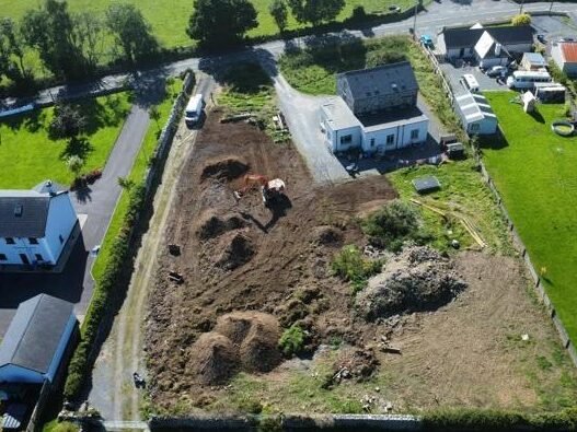 Land reclamation project clearing overgrown field for farming use